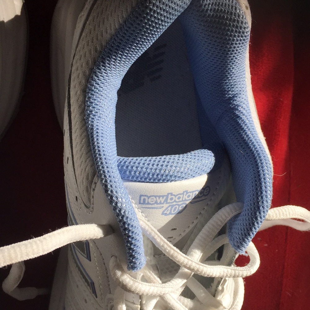 Great pair of NEW BALANCE white leather sneakers , recommended by podiatrists.